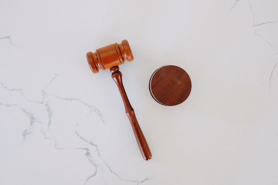 brown-gavel-on-marble-surface