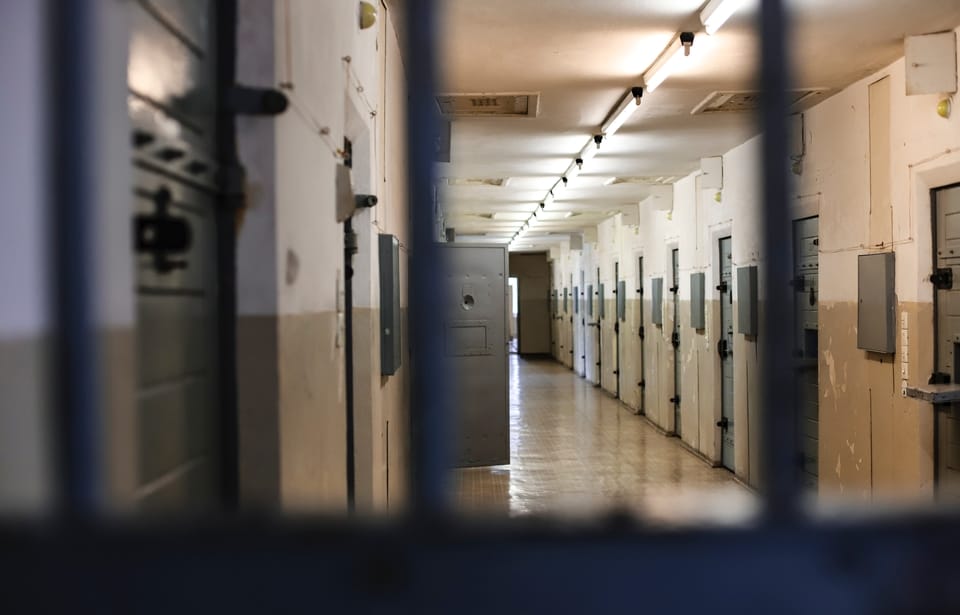 prison-hallway-view-from-behind-bars